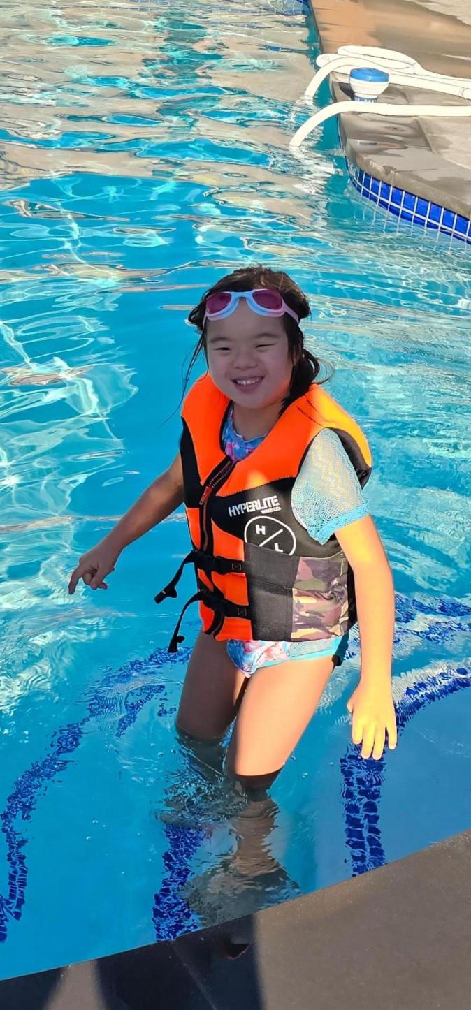 child swimming instructor pool